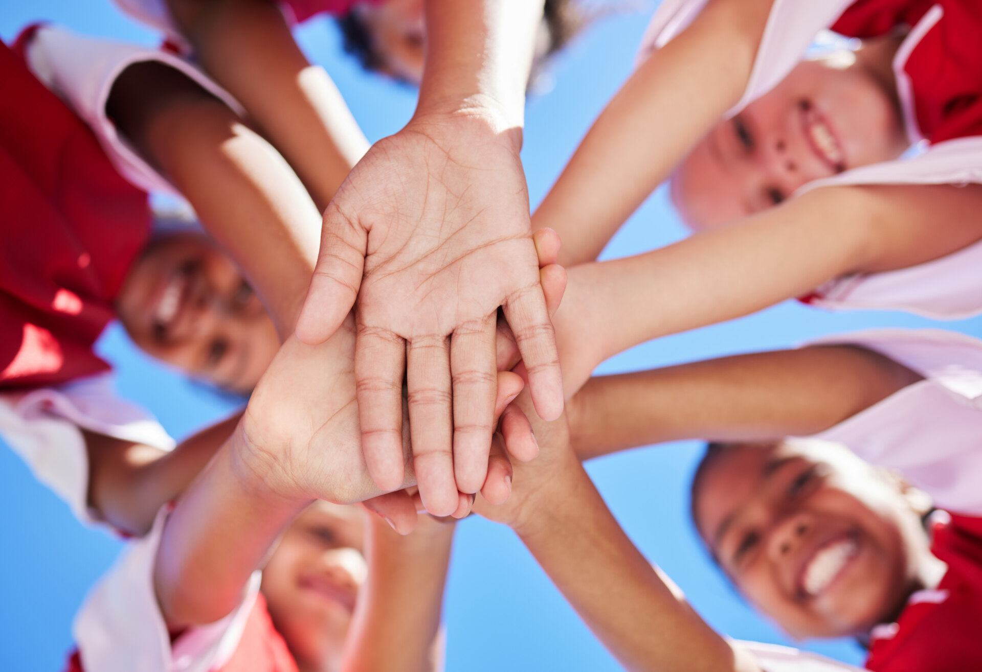 Team, children and soccer athlete hands together to show sport community, support and success. Fitness, football and exercise training proud hand sign of friends and players ready for teamwork.